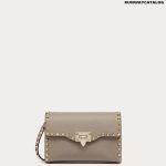 SMALL ROCKSTUD GRAINY CALFSKIN CROSSBODY BAG