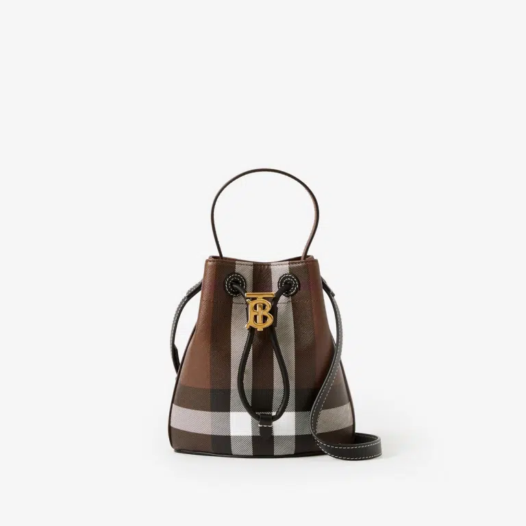 A Burberry Check Drawcord Bucket Bag, featuring a top handle, detachable crossbody strap, polished metal hardware, and a cotton-blend lining with a Thomas Burberry Monogram.