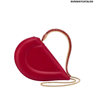 Bvlgari Serpenti Cuore 1968 top handle bag in royal ruby calf leather with a serpentine metallic handle and multicolored enamel detailing.