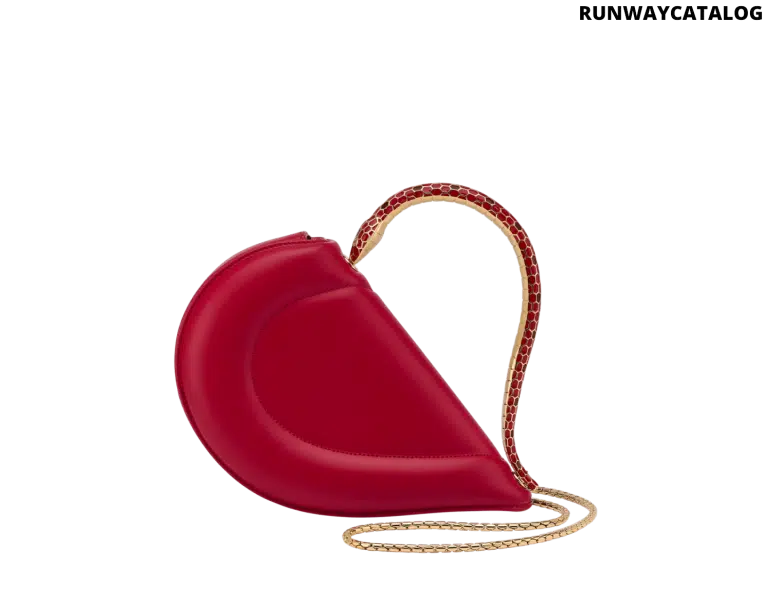 Bvlgari Serpenti Cuore 1968 top handle bag in royal ruby calf leather with a serpentine metallic handle and multicolored enamel detailing.