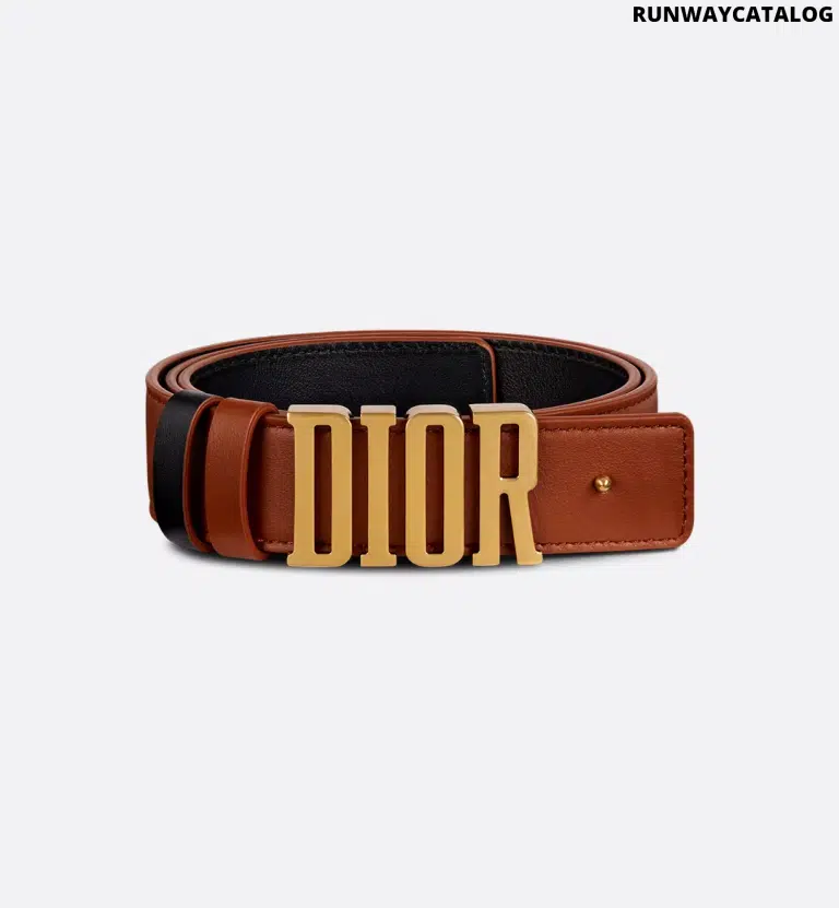 Dior D-Fence Belt in reversible calfskin with a removable Dior buckle, antique gold-finish detailing, and two removable loops for a customizable look.