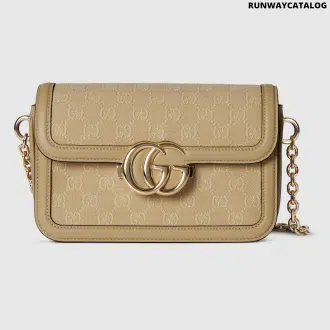 Gucci Go Small Shoulder Bag in Beige GG canvas with gold-toned hardware, a detachable mirror, and an adjustable strap for versatile styling.