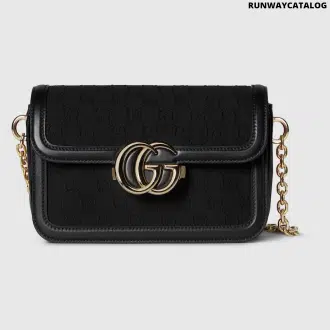 Gucci Go Small Shoulder Bag in Black GG canvas with gold-toned hardware, a detachable mirror, and an adjustable strap for versatile styling.