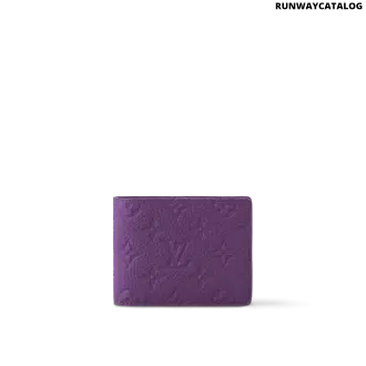 Louis Vuitton Multiple Wallet in Purple Night Taurillon Monogram cowhide leather, featuring an embossed pattern, deep purple hue, and a well-organized interior.