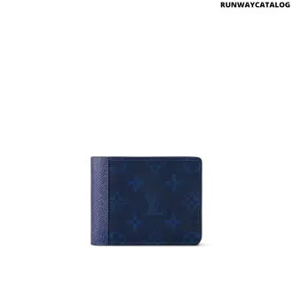 The Louis Vuitton Multiple Wallet in Navy Blue features Monogram Pacific coated canvas and Taiga leather, silver-tone hardware, and a well-organized interior with slots for cards, receipts, and bills.