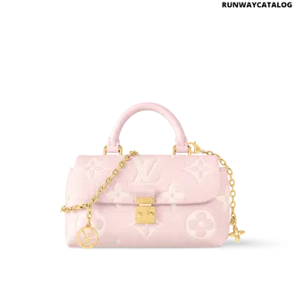 Nano Madeleine bag in bicolor Monogram Empreinte leather with gold-tone S-Lock closure and removable chain.