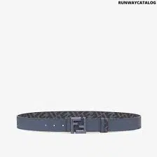 Fendi reversible belt in blue Cuoio Romano leather with FF rounded stud buckle and jeans blue-colored FF canvas interior, a sleek and stylish accessory for any wardrobe.