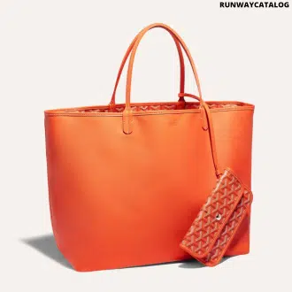 Goyard Anjou GM bag featuring a reversible leather and Goyardine canvas design, spacious interior, and ergonomic handles for comfortable carrying