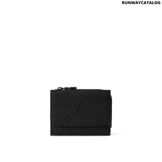 Louis Vuitton Pilot Wallet in black embossed Taurillon Monogram leather with a stud flap opening and six card slots.